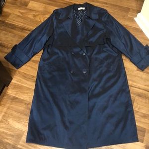 Elegant reflective blue trenchcoat
